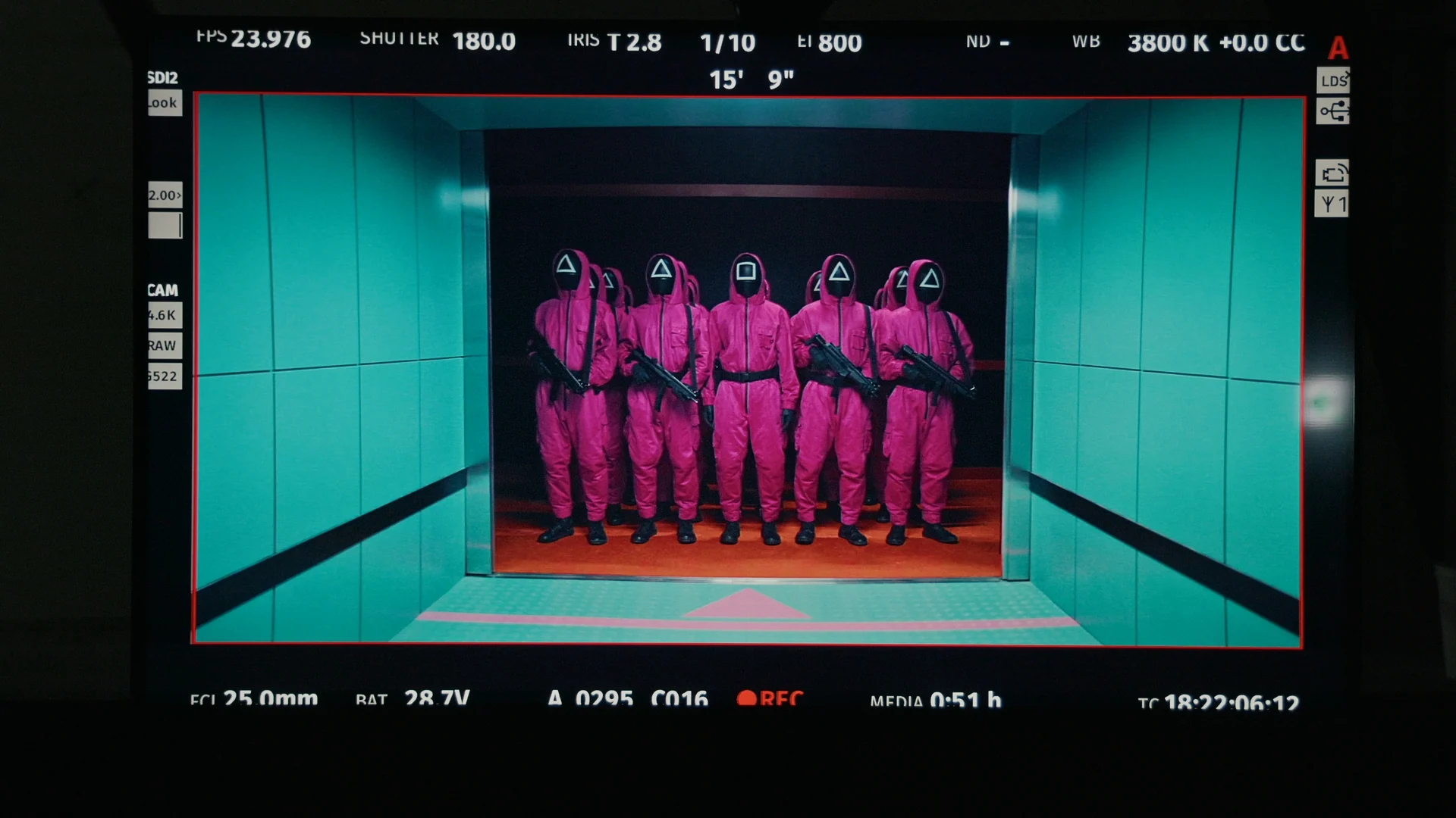Inside Squid Game S2 — production monitor showing pink guards lined up in the elevator