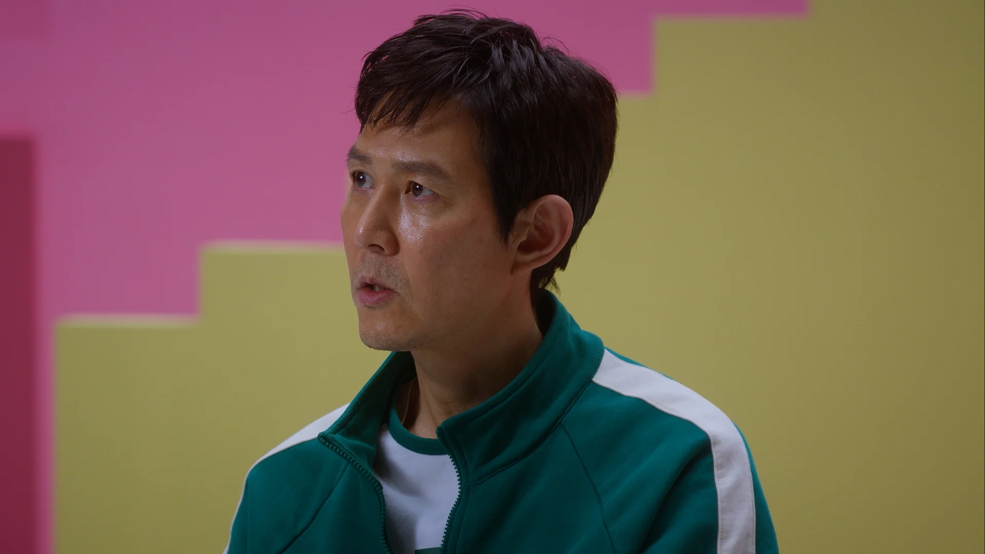 Inside Squid Game S2 — Lee Jung-jae interviewed on the pastel staircase set