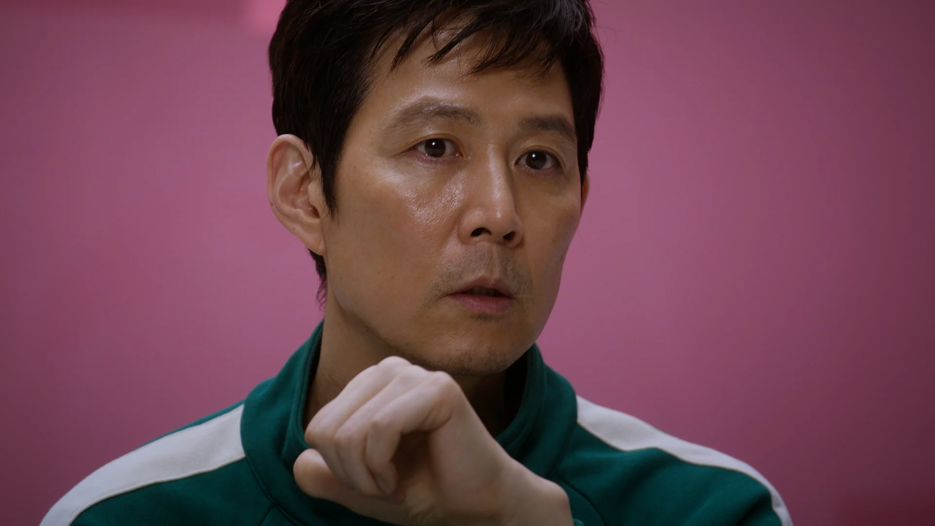 Inside Squid Game S2 — Lee Jung-jae in a close, contemplative interview moment