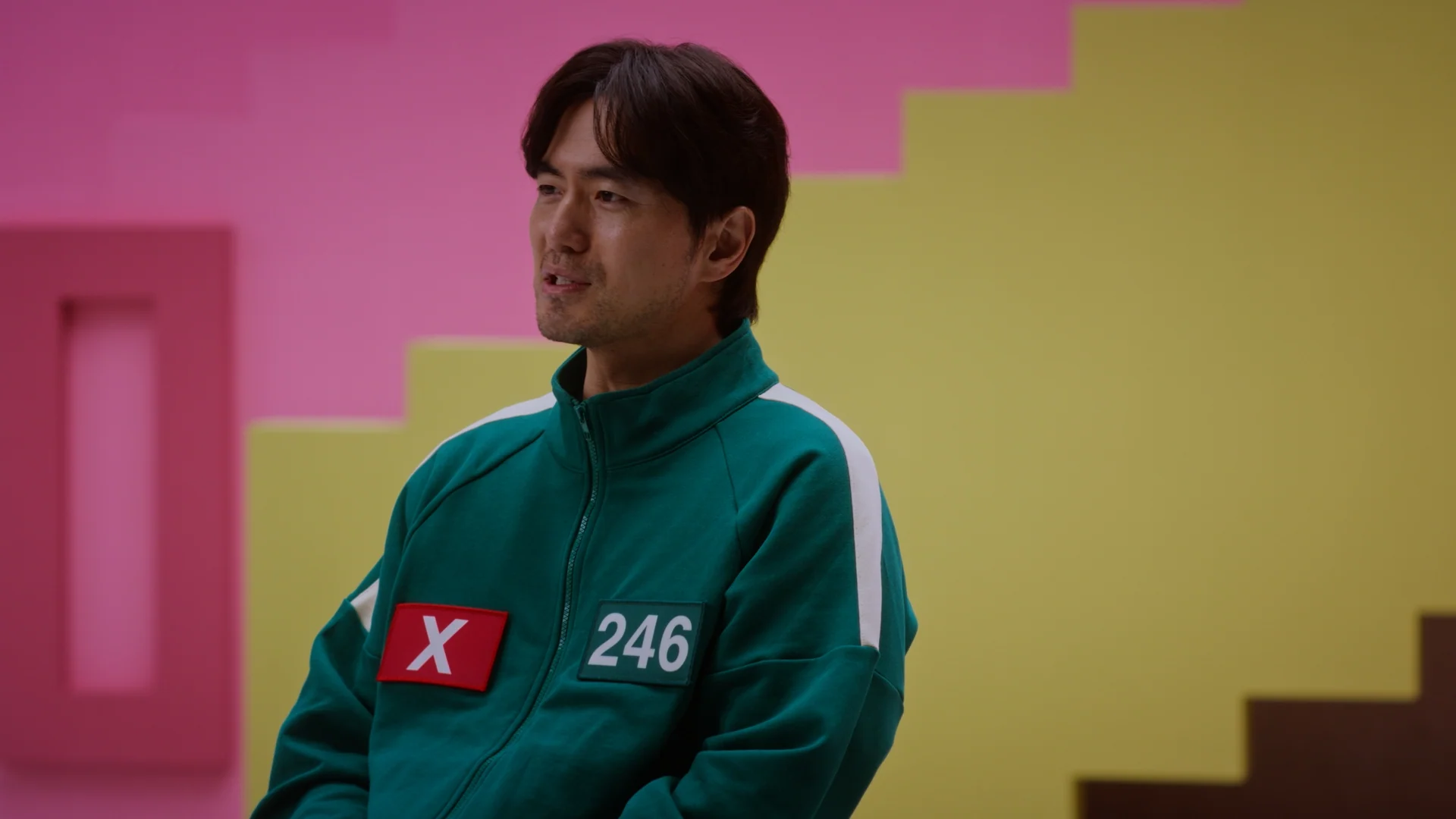 Inside Squid Game S2 — Player 246 actor interviewed in the green tracksuit