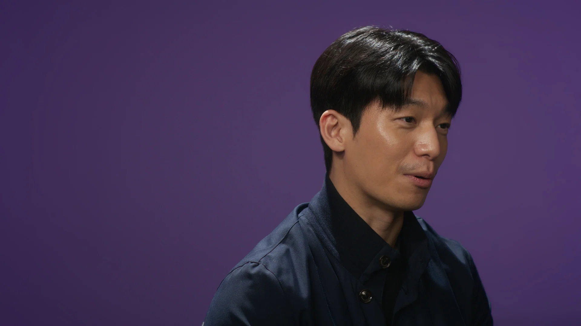 Inside Squid Game S2 — cast interview against the purple backdrop