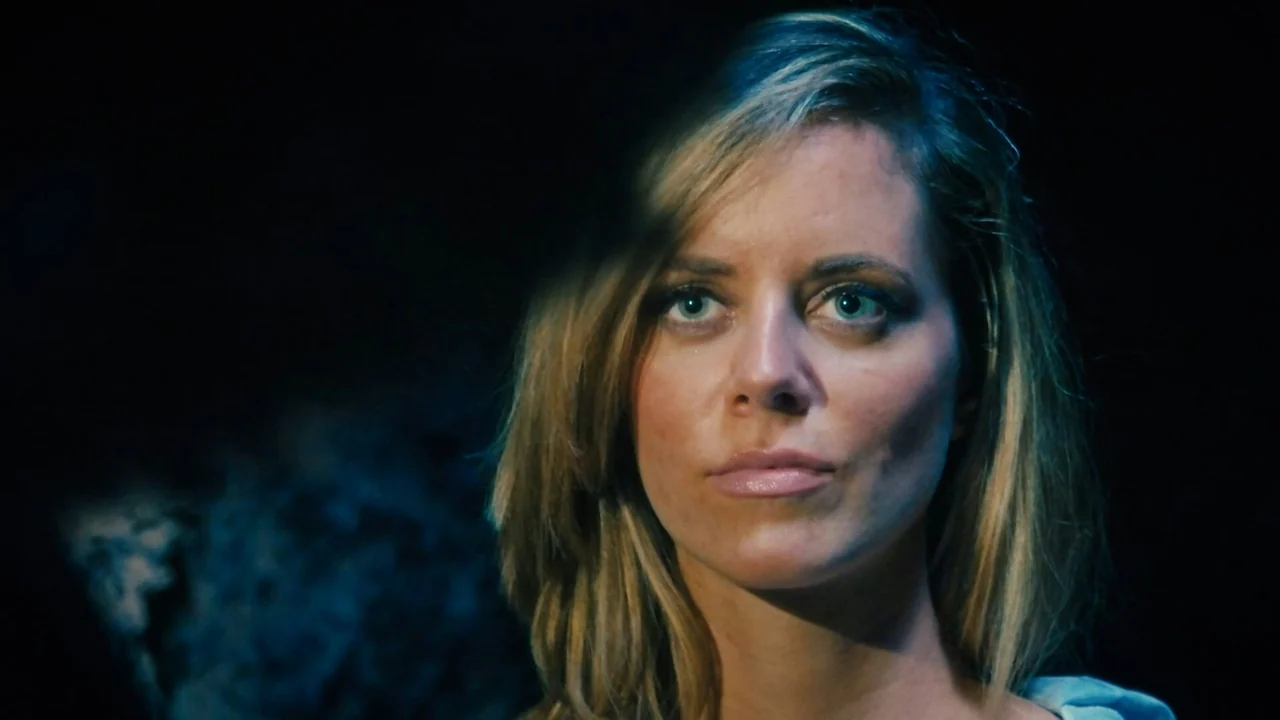 Graded frame — cool, dramatic portrait in low light